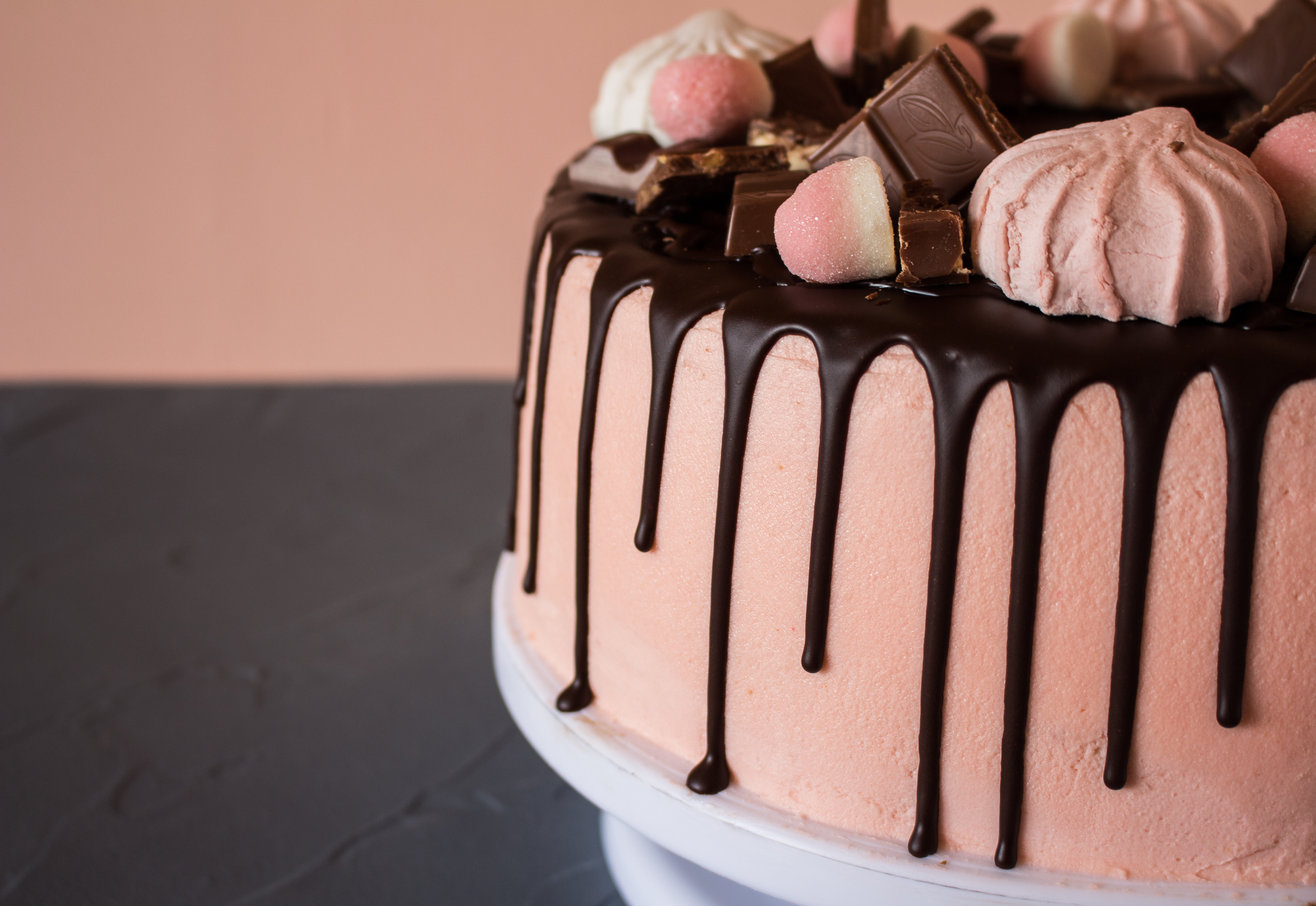 Decorated cake beside flowers