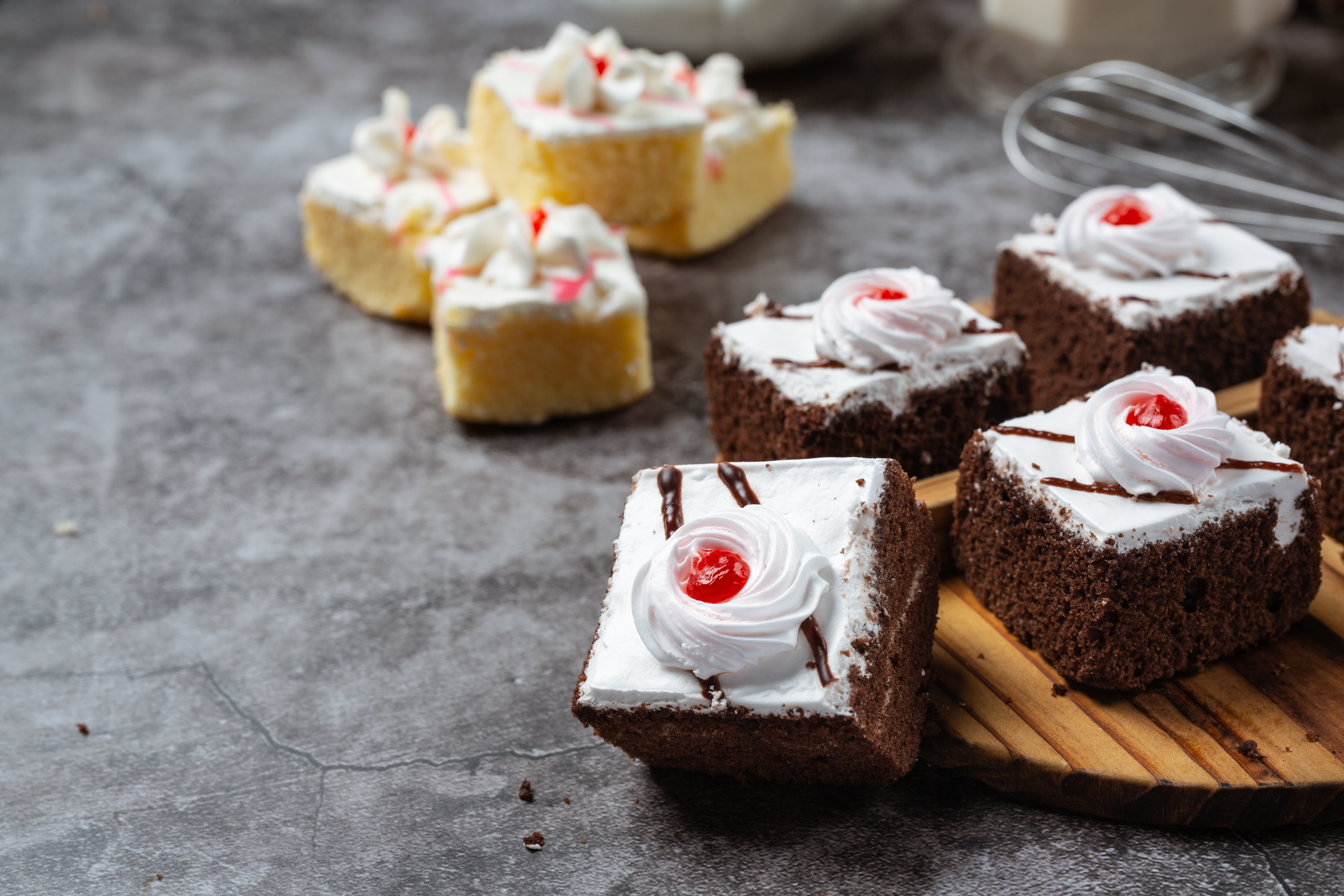Decorated cake beside flowers